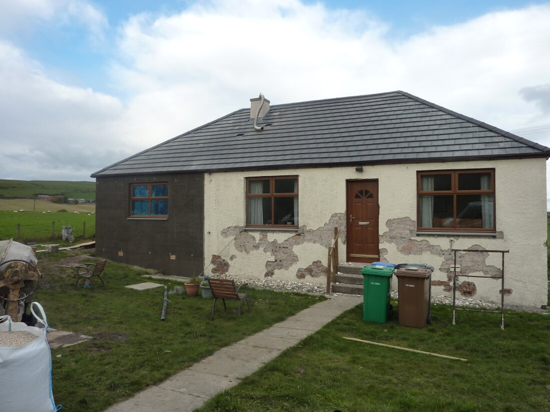 Semi-detached home with new roughcast finish